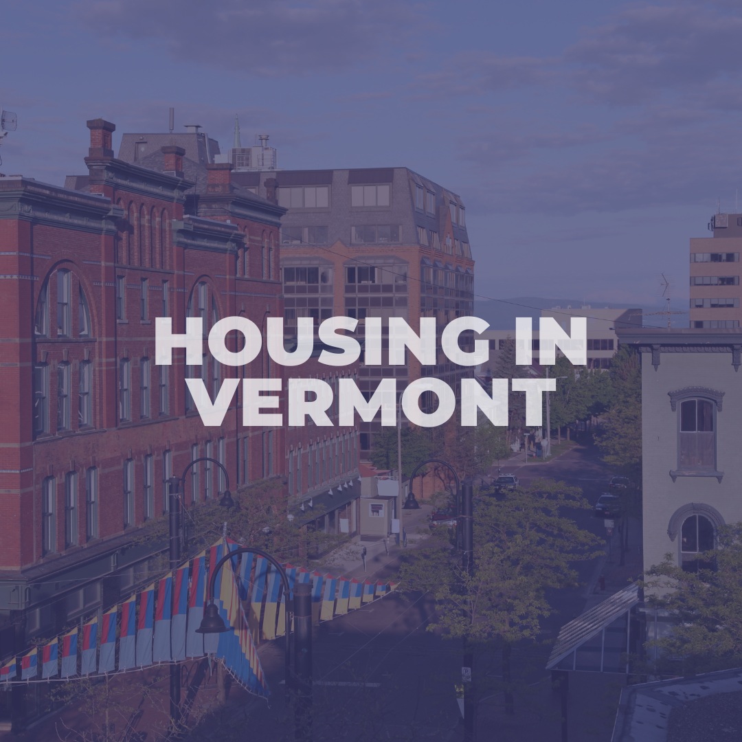 A picture of the city with text that reads housing in vermont.